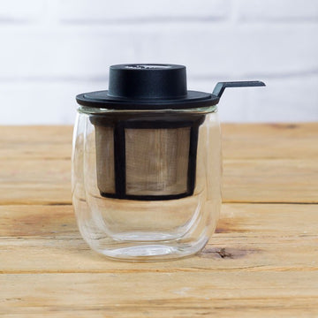 Taza de té de cristal con infusor y tapa